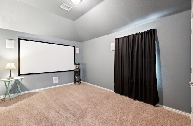 14209 Signal Hill Dr, Little Elm, TX 75068 - carpeted cinema with baseboards, vaulted ceiling, and visible vents
