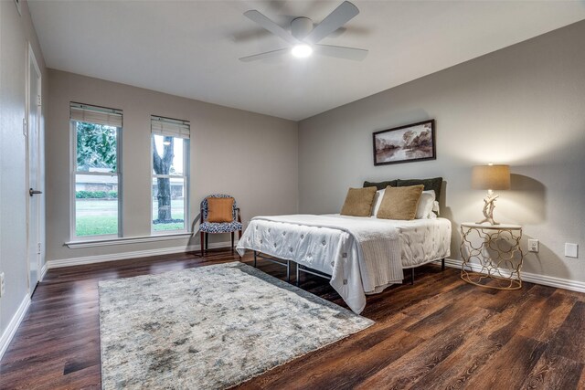 bedroom featuring wood finished floors, ceiling fan, and baseboards