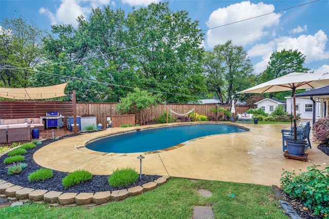 view of swimming pool with a fenced in pool, a fenced backyard, a patio, and an outdoor hangout area