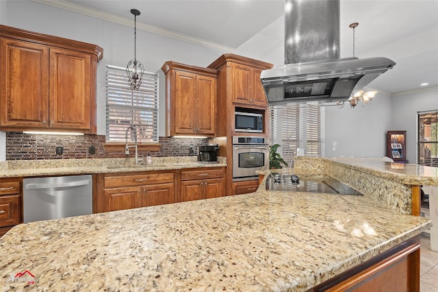 kitchen featuring brown cabinetry, island range hood, a sink, appliances with stainless steel finishes, and backsplash