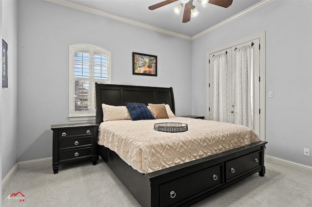 bedroom featuring baseboards, ornamental molding, a ceiling fan, and light carpet
