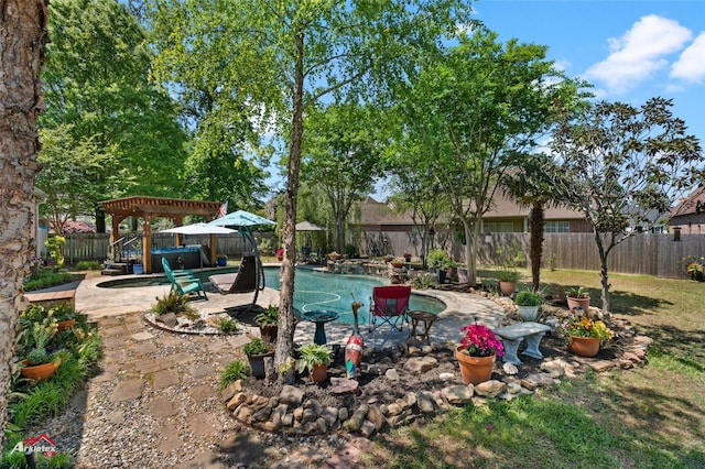 view of yard featuring a fenced backyard, a fenced in pool, and a patio area