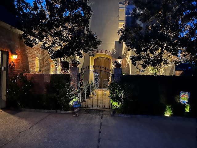 view of front facade with a gate and fence