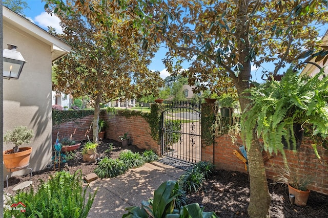 view of gate with fence