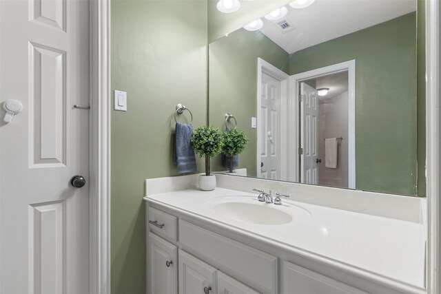 bathroom with visible vents and vanity