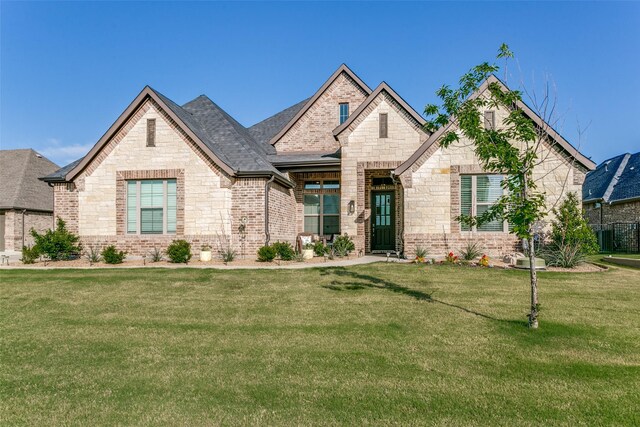 12492 Palmer Dr, Fort Worth, TX 76179 - french country inspired facade with roof with shingles, a front yard, and stone siding