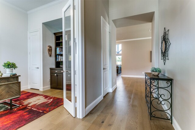 12492 Palmer Dr, Fort Worth, TX 76179 - hallway with baseboards, ornamental molding, and wood finished floors