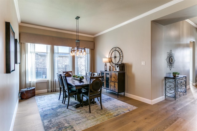 12492 Palmer Dr, Fort Worth, TX 76179 - dining space with baseboards, crown molding, wood finished floors, and a chandelier