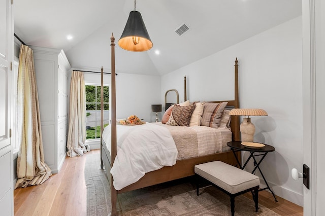 bedroom featuring lofted ceiling, visible vents, recessed lighting, and light wood finished floors