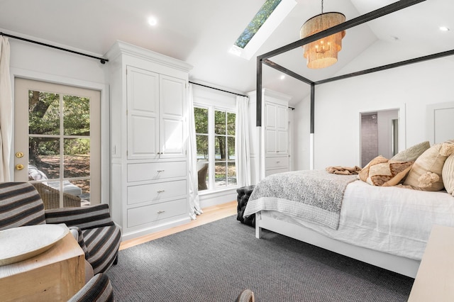bedroom with lofted ceiling with skylight, recessed lighting, and light wood finished floors