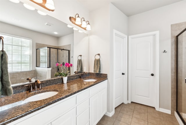 420 Westminster Dr, Lewisville, TX 75056 - full bath featuring tile patterned flooring, a sink, double vanity, and a shower stall