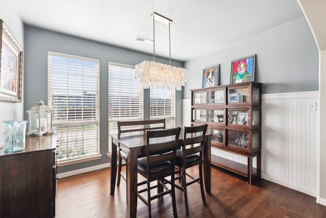420 Westminster Dr, Lewisville, TX 75056 - dining space with a chandelier, wainscoting, wood finished floors, and visible vents