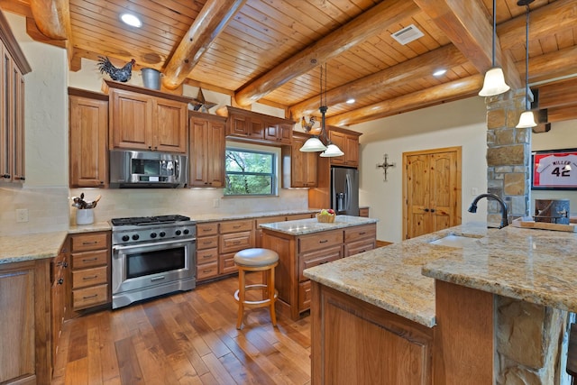 kitchen with a sink, stainless steel appliances, a kitchen island, wooden ceiling, and brown cabinetry