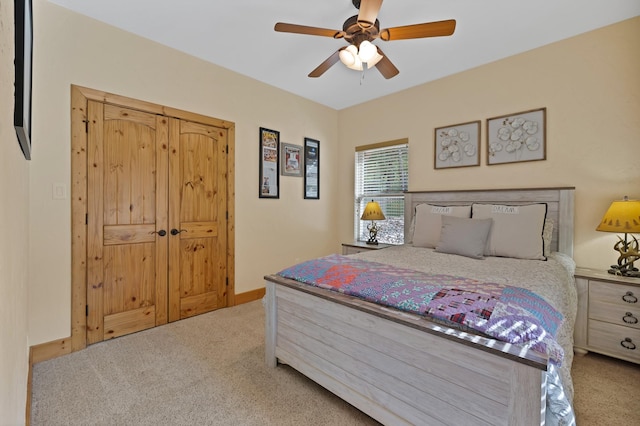 bedroom featuring a ceiling fan, carpet, and baseboards