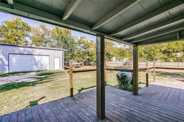 deck with fence, an outdoor structure, and a yard