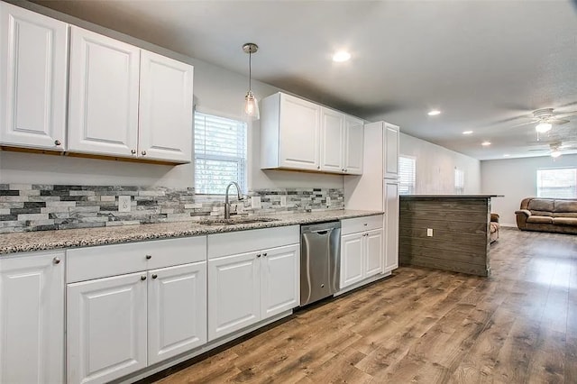 605 N Snyder Ave, Justin, TX 76247 - kitchen with dishwasher, ceiling fan, backsplash, white cabinetry, and recessed lighting