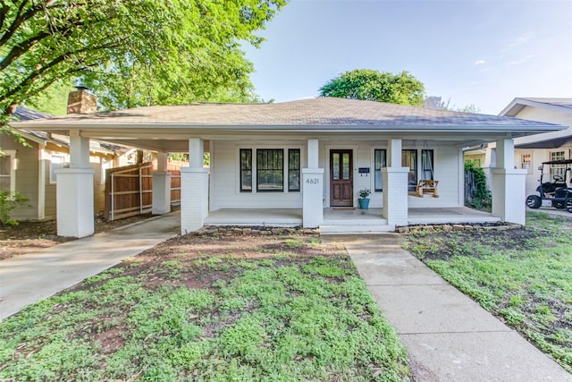 4621 Pershing Ave, Fort Worth, TX 76107 - ranch-style home featuring an attached carport, covered porch, driveway, a chimney, and fence