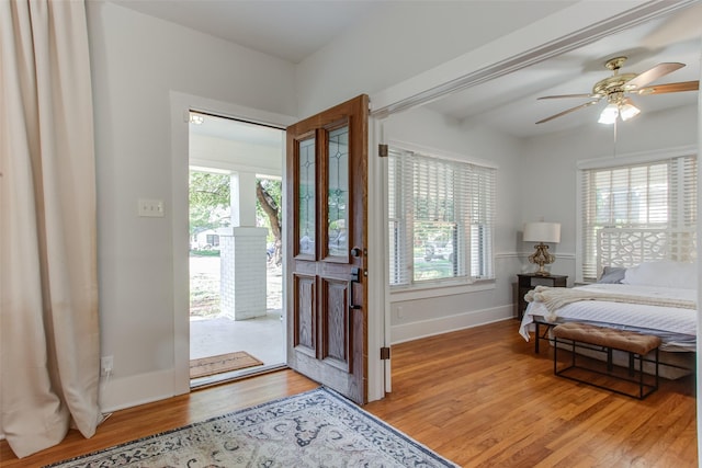 4621 Pershing Ave, Fort Worth, TX 76107 - foyer featuring baseboards, light wood-type flooring, and a ceiling fan