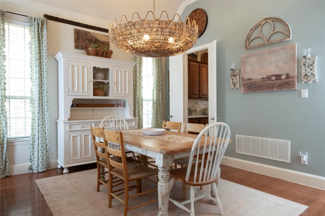 2621 Timberhollow Dr, Little Elm, TX 75068 - dining room featuring visible vents, baseboards, wood finished floors, and plenty of natural light
