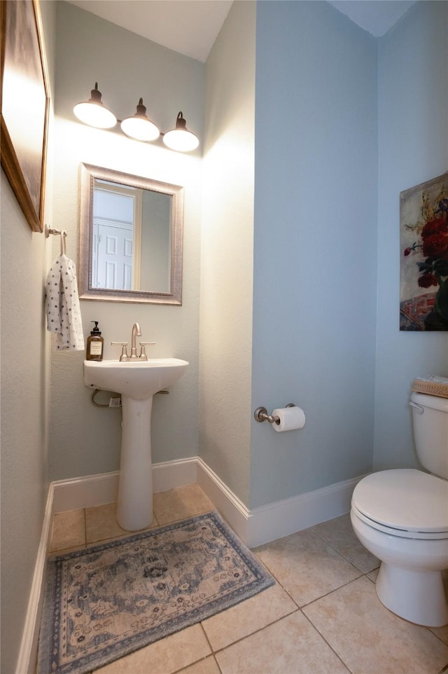 2621 Timberhollow Dr, Little Elm, TX 75068 - half bathroom with toilet, tile patterned flooring, and baseboards