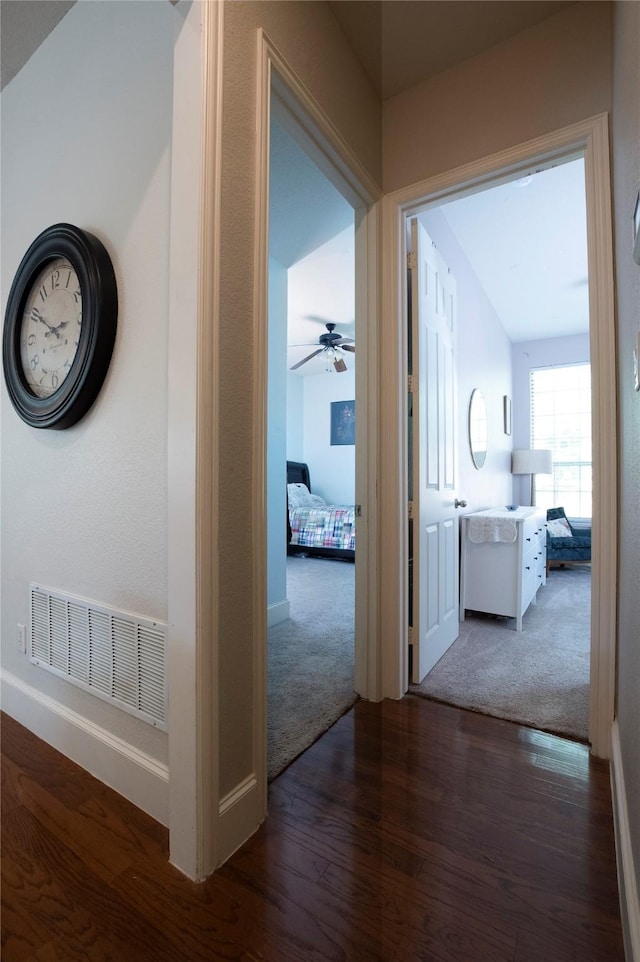 2621 Timberhollow Dr, Little Elm, TX 75068 - hall featuring baseboards, visible vents, wood finished floors, and carpet flooring