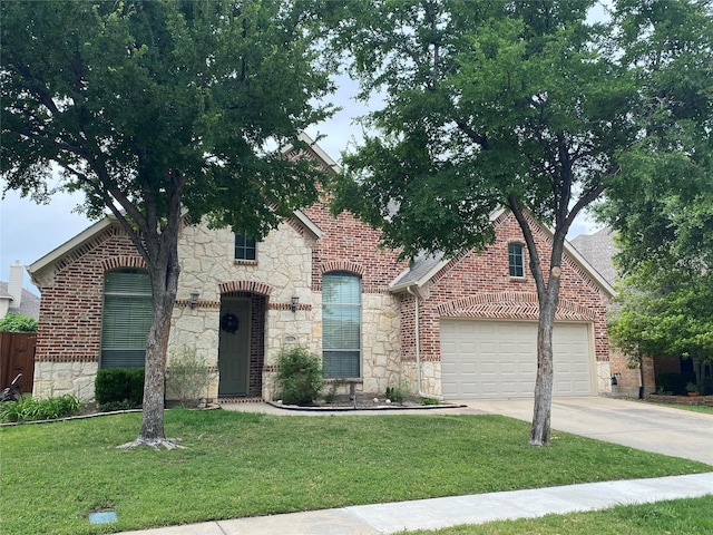2621 Timberhollow Dr, Little Elm, TX 75068 - view of front of home with a front lawn, driveway, and stone siding