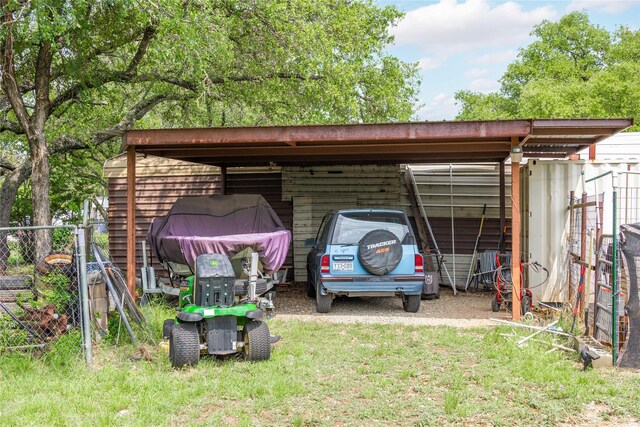 4991 Thunderbird Dr, May, TX 76857 - view of outdoor structure featuring a detached carport and fence