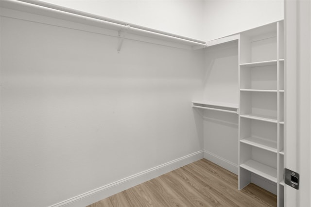 206 Splitrail Dr, Mabank, TX 75143 - spacious closet with wood finished floors