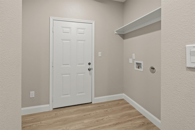 206 Splitrail Dr, Mabank, TX 75143 - clothes washing area with baseboards, hookup for a washing machine, light wood-style floors, and laundry area