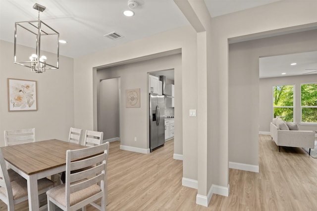 206 Splitrail Dr, Mabank, TX 75143 - dining area featuring recessed lighting, an inviting chandelier, light wood finished floors, baseboards, and visible vents