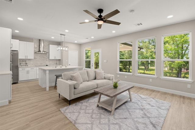 206 Splitrail Dr, Mabank, TX 75143 - living area with ceiling fan, recessed lighting, and light wood-style floors