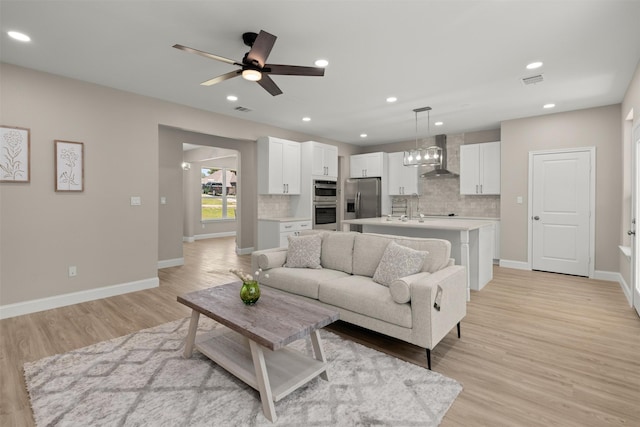 206 Splitrail Dr, Mabank, TX 75143 - living area featuring ceiling fan, light wood-type flooring, visible vents, and baseboards