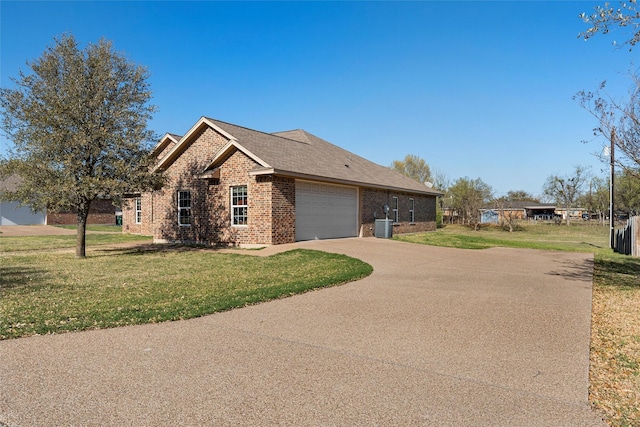 516 Celeste Dr, Robinson, TX 76706 - view of property exterior featuring brick siding, concrete driveway, a yard, and an attached garage