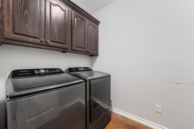 516 Celeste Dr, Robinson, TX 76706 - laundry area with washing machine and dryer and cabinet space