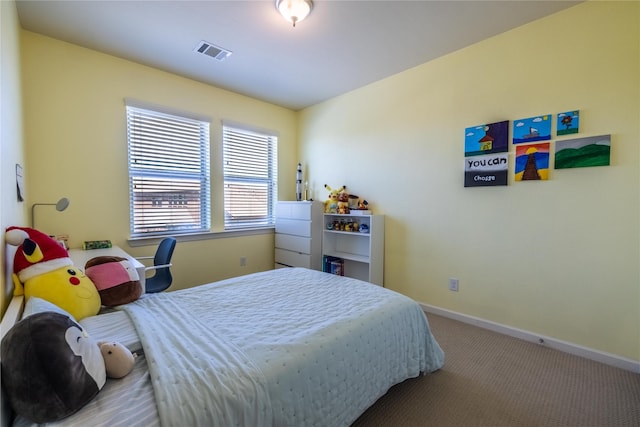 bedroom with baseboards, visible vents, and carpet flooring
