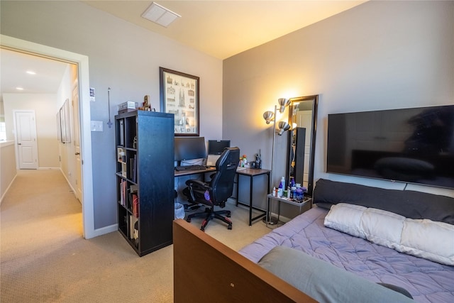 bedroom featuring baseboards, visible vents, and light colored carpet