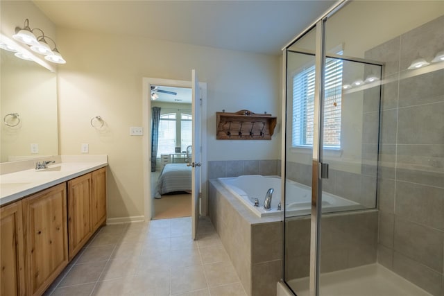 ensuite bathroom featuring a shower stall, a ceiling fan, a garden tub, and tile patterned flooring