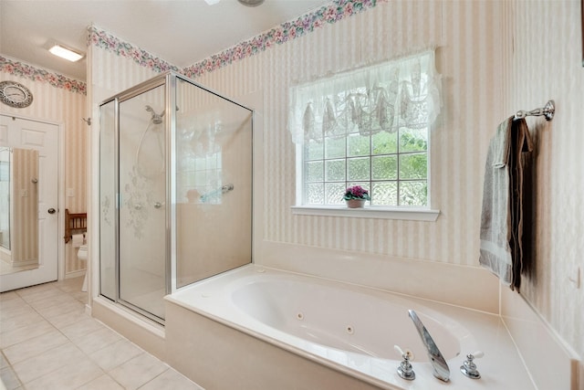 full bathroom with wallpapered walls, a jetted tub, tile patterned floors, and a stall shower