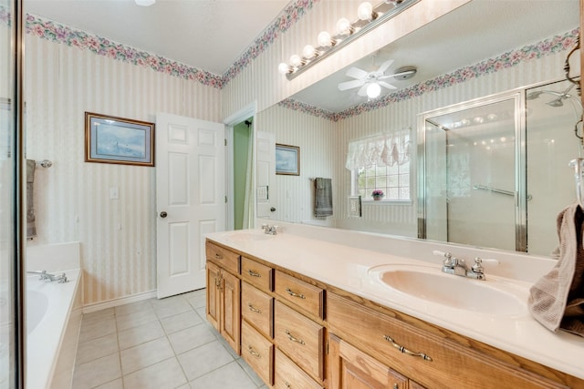 1219 Kiowa Dr E, Gainesville, TX 76240 - full bathroom featuring a sink, ceiling fan, a stall shower, and wallpapered walls