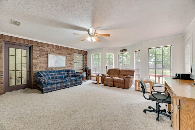 office area featuring carpet floors, ceiling fan, visible vents, and plenty of natural light