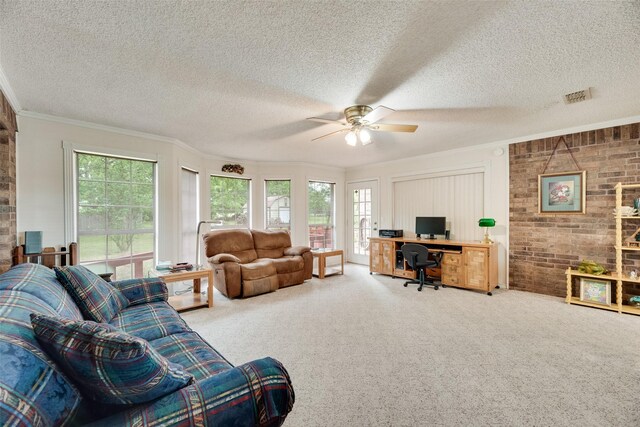 living room featuring visible vents, crown molding, a textured ceiling, a ceiling fan, and carpet