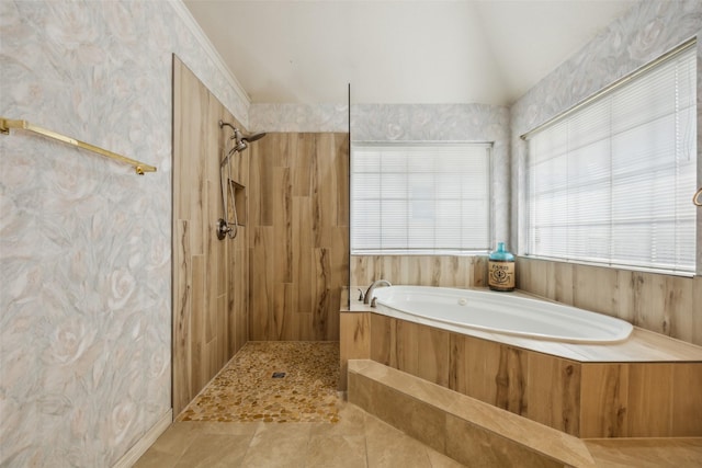 full bath featuring vaulted ceiling, a tile shower, and a bath