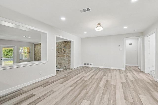 unfurnished living room with visible vents, light wood finished floors, and recessed lighting