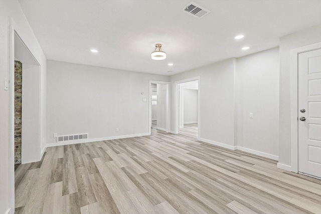 spare room featuring visible vents, light wood finished floors, and recessed lighting