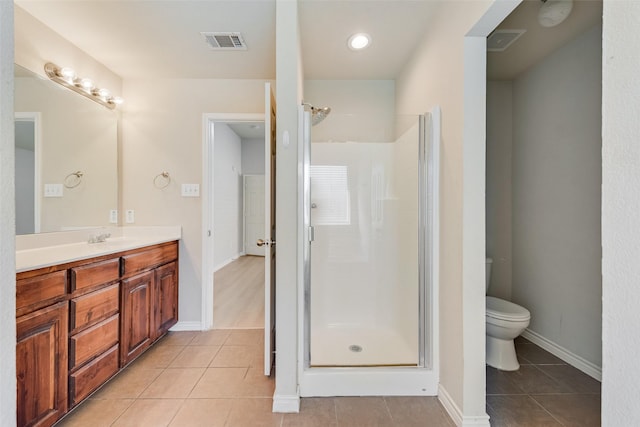 bathroom featuring visible vents, a stall shower, and tile patterned flooring