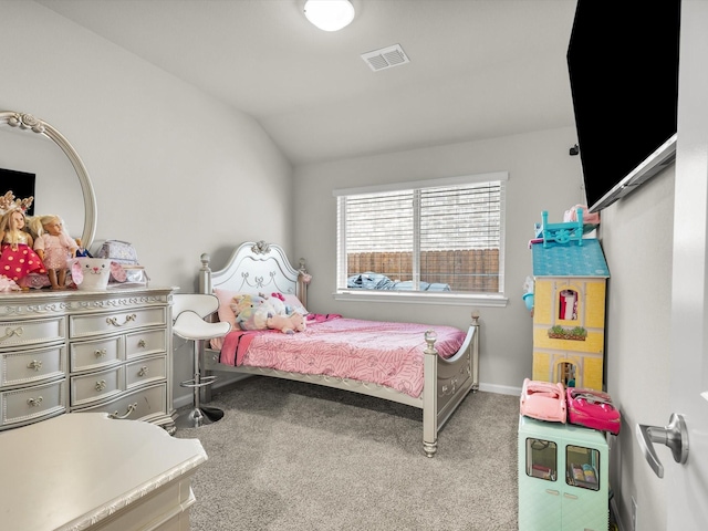 bedroom with lofted ceiling, visible vents, light colored carpet, and baseboards