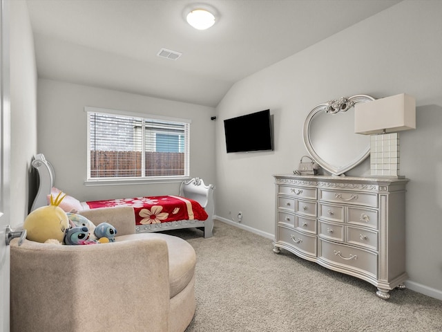 carpeted bedroom with visible vents, vaulted ceiling, and baseboards