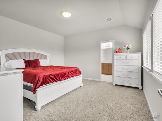 bedroom featuring light colored carpet, visible vents, lofted ceiling, and baseboards