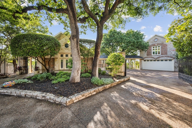 403 Hilltop, Trophy Club, TX 76262 - view of front of home with fence, concrete driveway, and stone siding