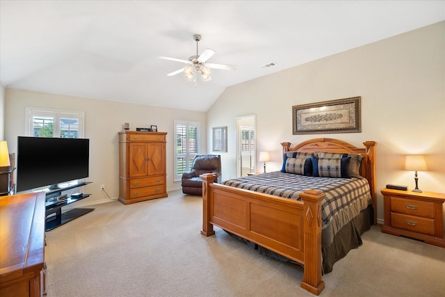 bedroom with visible vents, light carpet, lofted ceiling, and baseboards